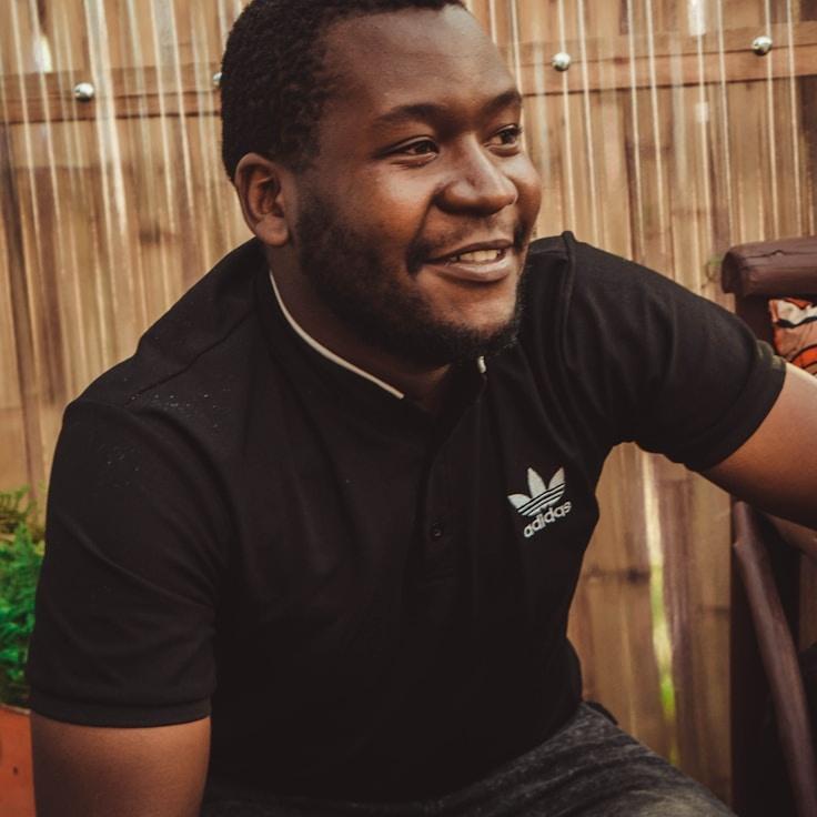 Alex Rivera, Lead Design Curator at MeadowQuartzHaven, reviewing corporate floral arrangements